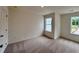 Bright bedroom offers plush carpeting and natural light from two windows at 1958 Asher Ln # 50, Conyers, GA 30013