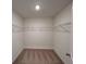 Walk-in closet with carpet flooring, wire shelving, and ample storage space at 1958 Asher Ln # 50, Conyers, GA 30013