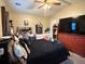 Spacious bedroom with vaulted ceiling, ceiling fan, and large television atop a red dresser at 2523 Bronco Trl, Duluth, GA 30096