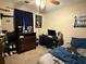 Neutral bedroom featuring a ceiling fan, lots of natural light, and laminate flooring at 2523 Bronco Trl, Duluth, GA 30096