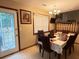 Cozy dining room featuring traditional furnishings and a view to the exterior at 2523 Bronco Trl, Duluth, GA 30096