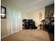 Another view of the spacious living room featuring stone fireplace and lots of natural light at 2523 Bronco Trl, Duluth, GA 30096