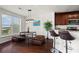Open dining area with hardwood floors, pendant lighting, and bar seating at 3334 Peachtree Ne Rd # 1609, Atlanta, GA 30326