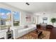 Bright living room with hardwood floors, modern decor, and stunning city views at 3334 Peachtree Ne Rd # 1609, Atlanta, GA 30326