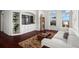 Bright living room with built-in shelves, hardwood floors, and access to a balcony at 3334 Peachtree Ne Rd # 1609, Atlanta, GA 30326