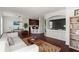 Open concept living area with hardwood floors, white walls and modern accents at 3334 Peachtree Ne Rd # 1609, Atlanta, GA 30326