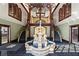Grand lobby with a water feature, dual staircases, and elegant lighting at 3334 Peachtree Ne Rd # 1609, Atlanta, GA 30326