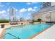 Enjoy this luxurious outdoor pool with cushioned lounge chairs and a beautiful skyline view at 3334 Peachtree Ne Rd # 1609, Atlanta, GA 30326