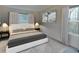 Serene bedroom with modern design, minimalist decor, and large windows offering a peaceful ambiance at 5002 Elowen Ln, Douglasville, GA 30135