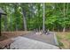 Serene backyard featuring a cozy fire pit area, perfect for outdoor relaxation and entertaining guests at 620 Alcovy Springs Dr, Lawrenceville, GA 30045