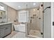 Bright bathroom featuring a soaking tub with a window view and a glass-enclosed shower at 620 Alcovy Springs Dr, Lawrenceville, GA 30045