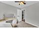 Bright bedroom with a vanity area and neutral carpet, offering a comfortable and functional space at 620 Alcovy Springs Dr, Lawrenceville, GA 30045