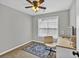 Well-lit bedroom featuring a vanity and neutral carpet, creating a versatile and inviting space at 620 Alcovy Springs Dr, Lawrenceville, GA 30045