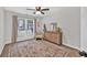 Spacious bedroom featuring a patterned rug and large window with drapes, enhancing the room's appeal at 620 Alcovy Springs Dr, Lawrenceville, GA 30045