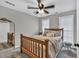 Cozy bedroom with a wood-framed bed and a decorative mirror, creating a peaceful retreat at 620 Alcovy Springs Dr, Lawrenceville, GA 30045