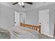 Comfortable bedroom featuring a wood-framed bed and neutral decor, offering a serene space at 620 Alcovy Springs Dr, Lawrenceville, GA 30045