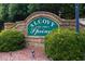 Alcove Spring community sign surrounded by greenery and landscape lighting at 620 Alcovy Springs Dr, Lawrenceville, GA 30045