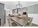 Spacious dining area with a modern light fixture and views into other living areas at 620 Alcovy Springs Dr, Lawrenceville, GA 30045