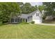 Charming one-story home featuring a well-manicured lawn, attached garage, and classic curb appeal at 620 Alcovy Springs Dr, Lawrenceville, GA 30045