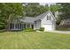 Charming home with well-manicured lawn, attached garage, and inviting curb appeal at 620 Alcovy Springs Dr, Lawrenceville, GA 30045