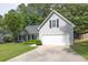 Well-kept home with a two-car garage, green lawn, and welcoming facade at 620 Alcovy Springs Dr, Lawrenceville, GA 30045