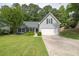 Attractive home with a neat front lawn, a two-car garage, and appealing exterior at 620 Alcovy Springs Dr, Lawrenceville, GA 30045