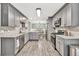 Bright, spacious kitchen featuring stainless steel appliances, subway tile backsplash, and wood flooring at 620 Alcovy Springs Dr, Lawrenceville, GA 30045