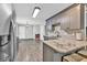 Modern kitchen with granite countertops, stainless steel appliances, and an island with seating at 620 Alcovy Springs Dr, Lawrenceville, GA 30045