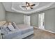 Tranquil primary bedroom with trey ceilings, neutral decor, and ensuite bathroom access at 620 Alcovy Springs Dr, Lawrenceville, GA 30045