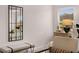 Comfortable bedroom with ample natural light and a decorative mirror. Includes accent chair and bench at 1023 Merritt Dr # 100, Villa Rica, GA 30180