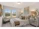 A beautifully decorated bedroom with large windows and neutral accents at 1023 Merritt Dr # 100, Villa Rica, GA 30180