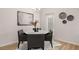 Bright dining area featuring a modern chandelier, stylish artwork, and a round marble-topped table at 1023 Merritt Dr # 100, Villa Rica, GA 30180