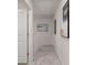 A hallway with carpeted floors and walls decorated with modern art at 1023 Merritt Dr # 100, Villa Rica, GA 30180