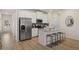 A modern kitchen featuring stainless steel appliances, and island seating at 1023 Merritt Dr # 100, Villa Rica, GA 30180