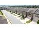 An aerial view showcases the townhomes with easy street access, lush landscaping, and community charm at 2924 Weyhill Trl, Buford, GA 30519