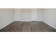 Spacious bedroom featuring wood-look flooring and two closets at 2924 Weyhill Trl, Buford, GA 30519