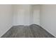 Bedroom with two closets and gray wood-look flooring at 2924 Weyhill Trl, Buford, GA 30519
