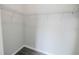 Walk-in closet featuring metal shelving and gray wood-look flooring at 2924 Weyhill Trl, Buford, GA 30519