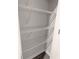 Storage closet featuring metal shelving and gray wood-look flooring at 2924 Weyhill Trl, Buford, GA 30519