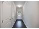 Bright entryway featuring dark wood floors and white paneled doors at 2924 Weyhill Trl, Buford, GA 30519