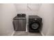 Laundry area with modern, front-load washer and dryer, maximizing space at 2924 Weyhill Trl, Buford, GA 30519