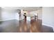 Spacious living room featuring hardwood floors, modern stairs, and an open layout to the kitchen at 2924 Weyhill Trl, Buford, GA 30519