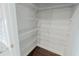 Walk-in pantry featuring metal shelves, offering plenty of storage space for kitchen essentials at 2924 Weyhill Trl, Buford, GA 30519