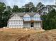 New construction home featuring an inviting entrance and gabled roof at 3425 Dr Bramblett Rd, Cumming, GA 30028