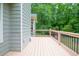 Back deck showcases views of the backyard and a fence, offering a private outdoor space and natural surroundings at 399 Towler Drs, Loganville, GA 30052