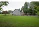 Expansive backyard with ample green space, a playset, and partial fencing, perfect for outdoor enjoyment and recreation at 399 Towler Drs, Loganville, GA 30052