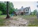 Spacious backyard with a playset, swing set, and fenced perimeter, offering a secure and enjoyable outdoor space at 399 Towler Drs, Loganville, GA 30052