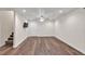 Finished basement with sleek flooring, recessed lighting, and a door leading to additional space at 399 Towler Drs, Loganville, GA 30052