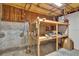 Unfinished basement with a workbench and exposed insulation provides opportunities for customization and additional storage space at 399 Towler Drs, Loganville, GA 30052