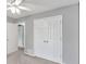 A secondary bedroom featuring a double closet and neutral carpet at 399 Towler Drs, Loganville, GA 30052